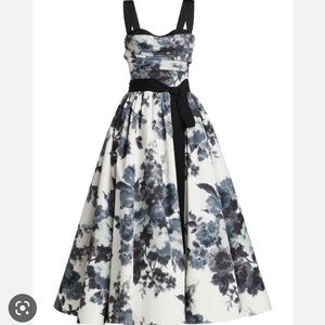 Description:  Carolina Herrera dress with bow. Size 4. New with tags.